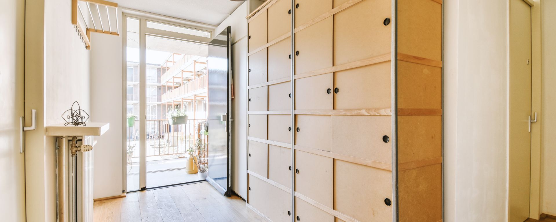 Hallway in home with plenty of cupboard space.